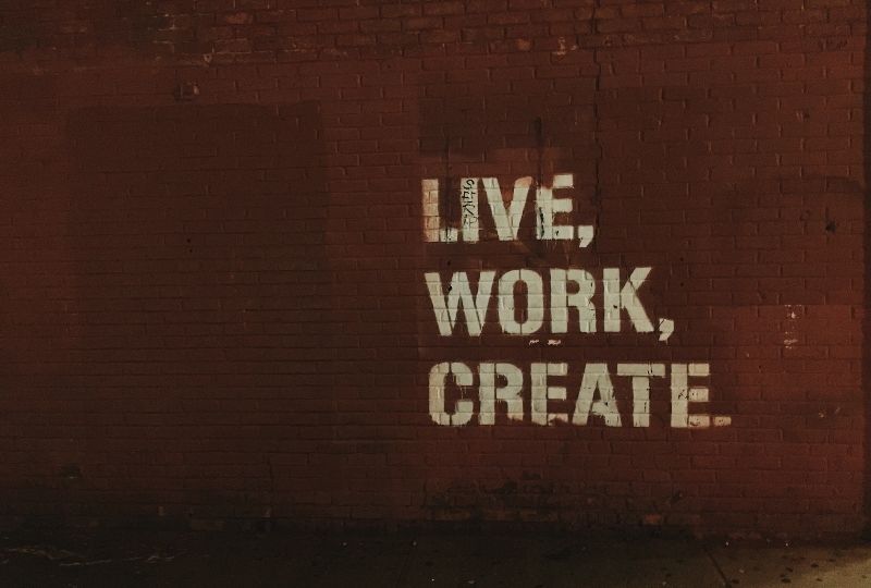 Live Work Create Words Against Brick Wall