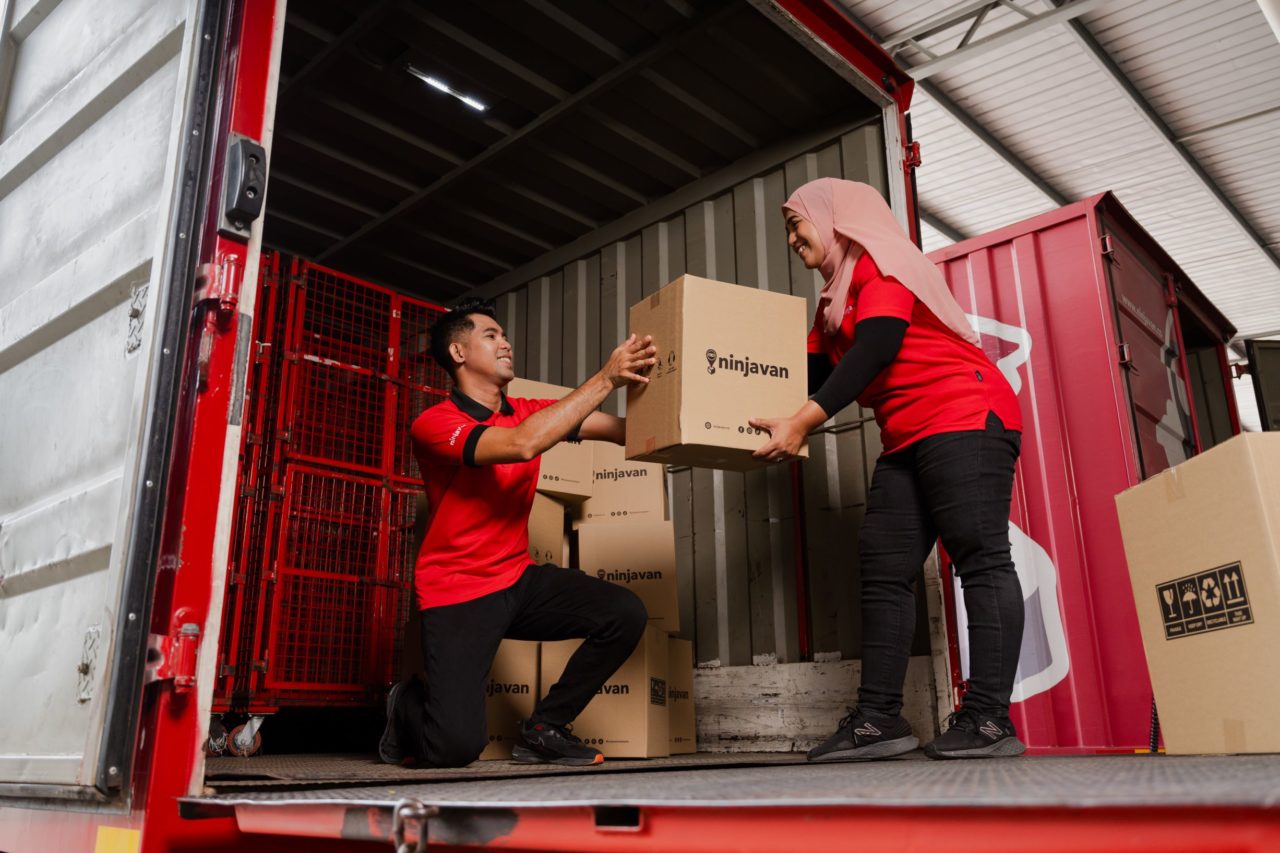 A Ninja Van truck transporting goods for stock replenishment in Malaysia.